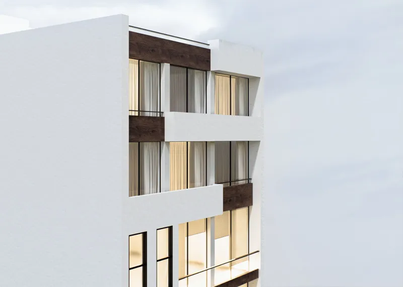 Detalle de la esquina superior del edificio, con el quiebre de los volúmenes blancos.