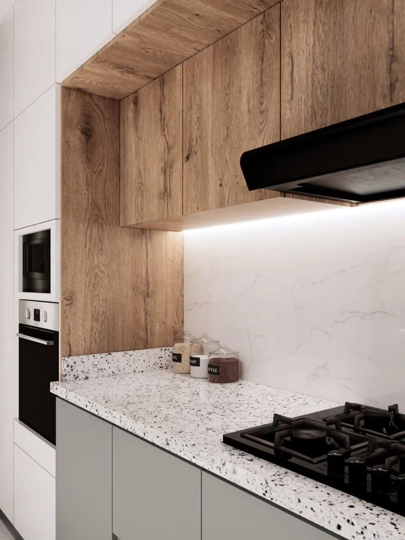 Detalle de la cocina: encimera de terrazo, alacena de madera y frente de mármol.