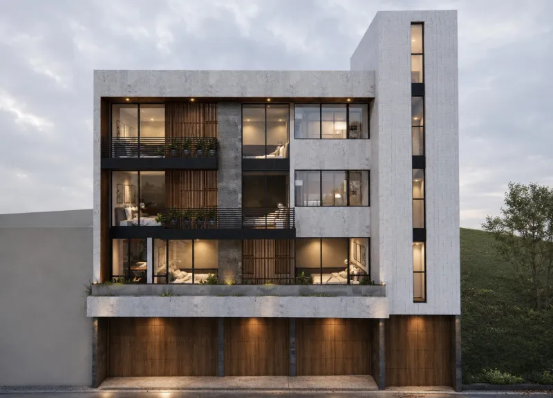 Elevación frontal del edificio en ladera al anochecer, con los interiores iluminados tras los ventanales.